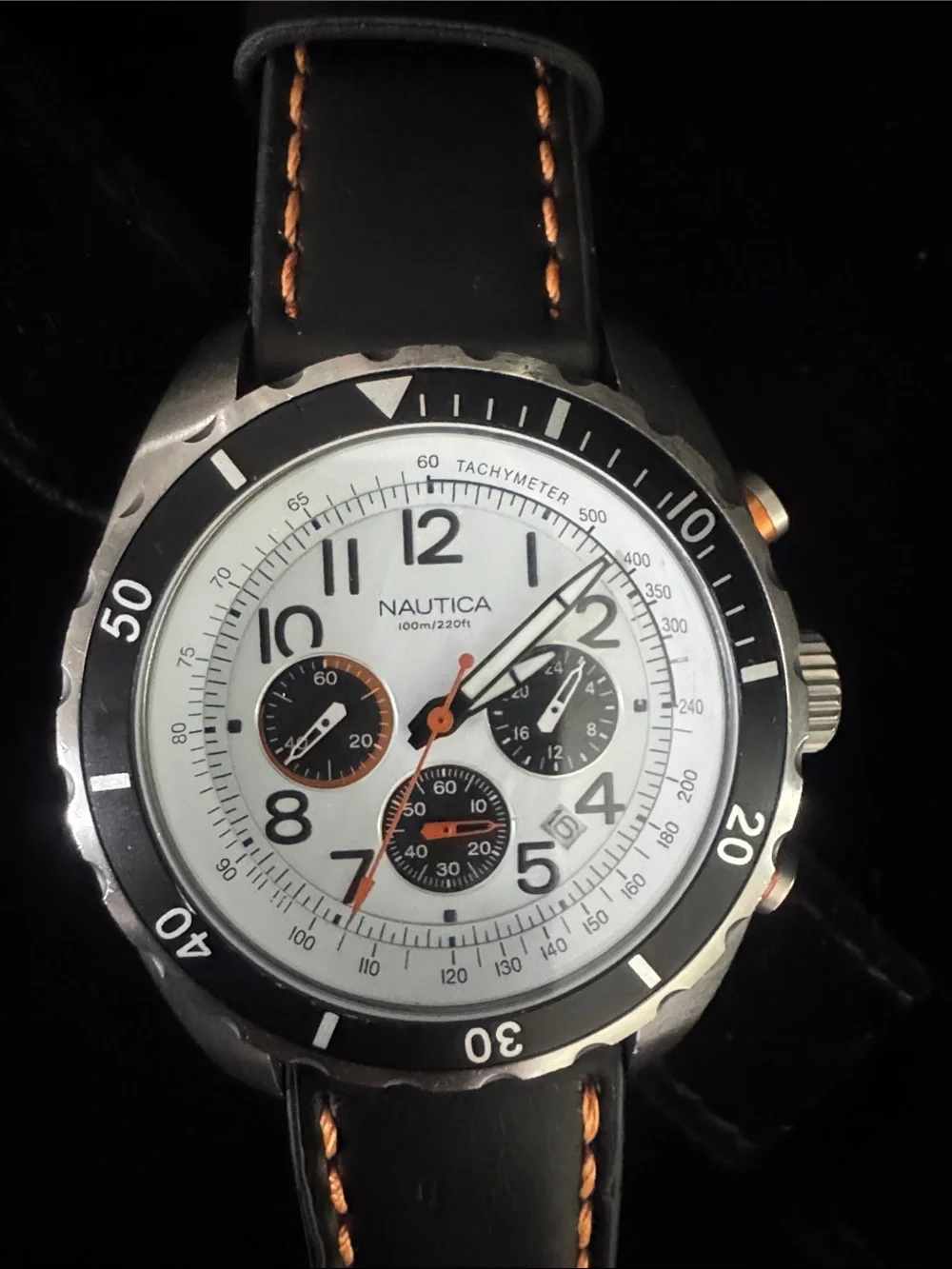 Nautica White Dial Chronograph Watch with Black Bezel and Orange Accents